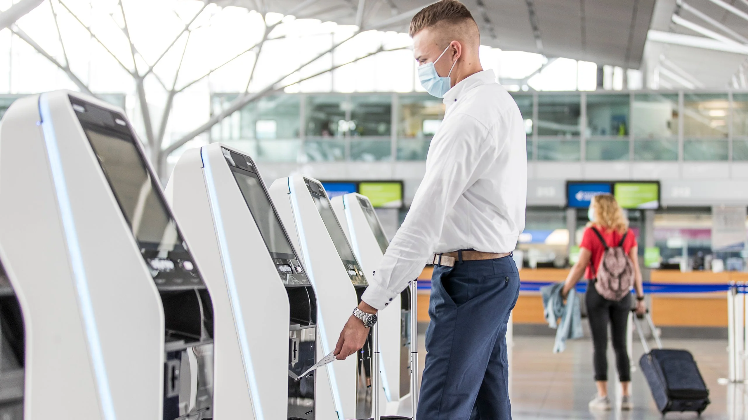 man-using-self-service-kiosks